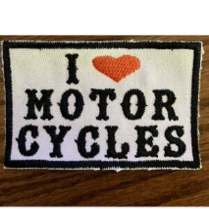 I LOVE (deep orange heart) MOTORCYCLES patch white background black lettering
